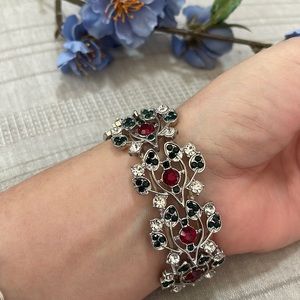 Red silver and green stretchy rhinestone bracelet.